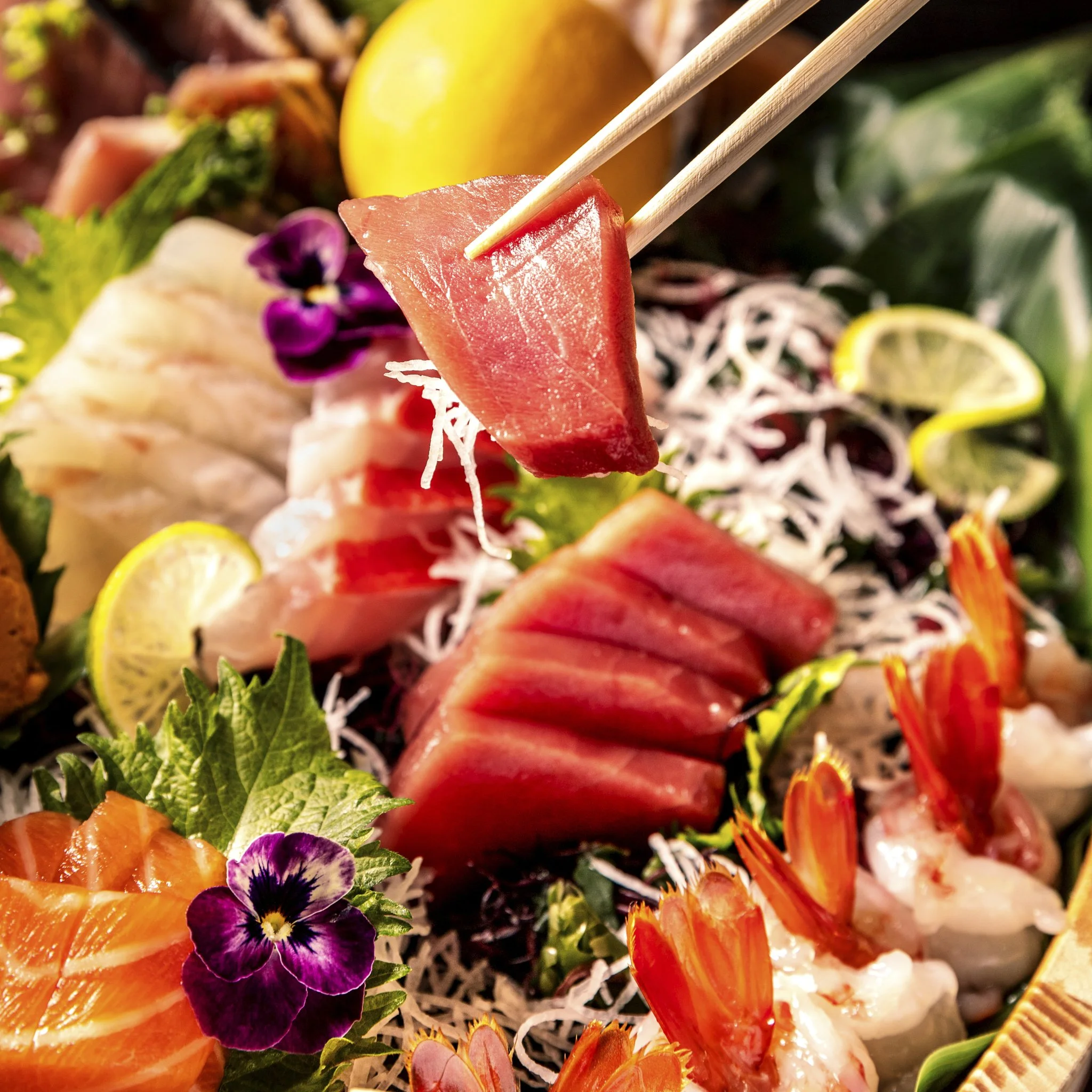 Chopsticks Grabbing sea food platter at Pabu, photographed by Neetu Laddha, restaurant photographer San Francisco