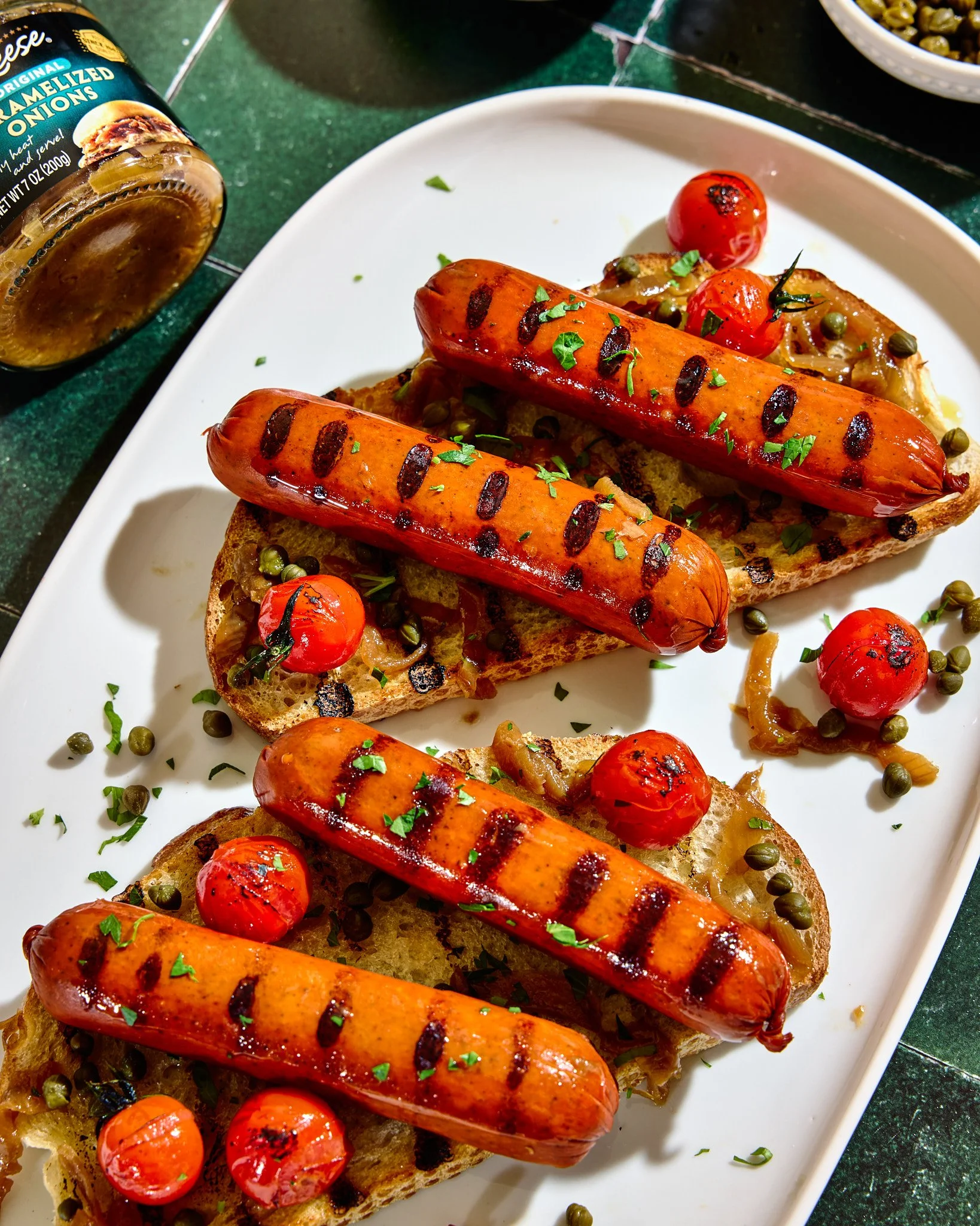 Close up - Grilled hot dogs on toast with Reese capers and onions, photographed by Neetu Laddha, San Francisco food photographer