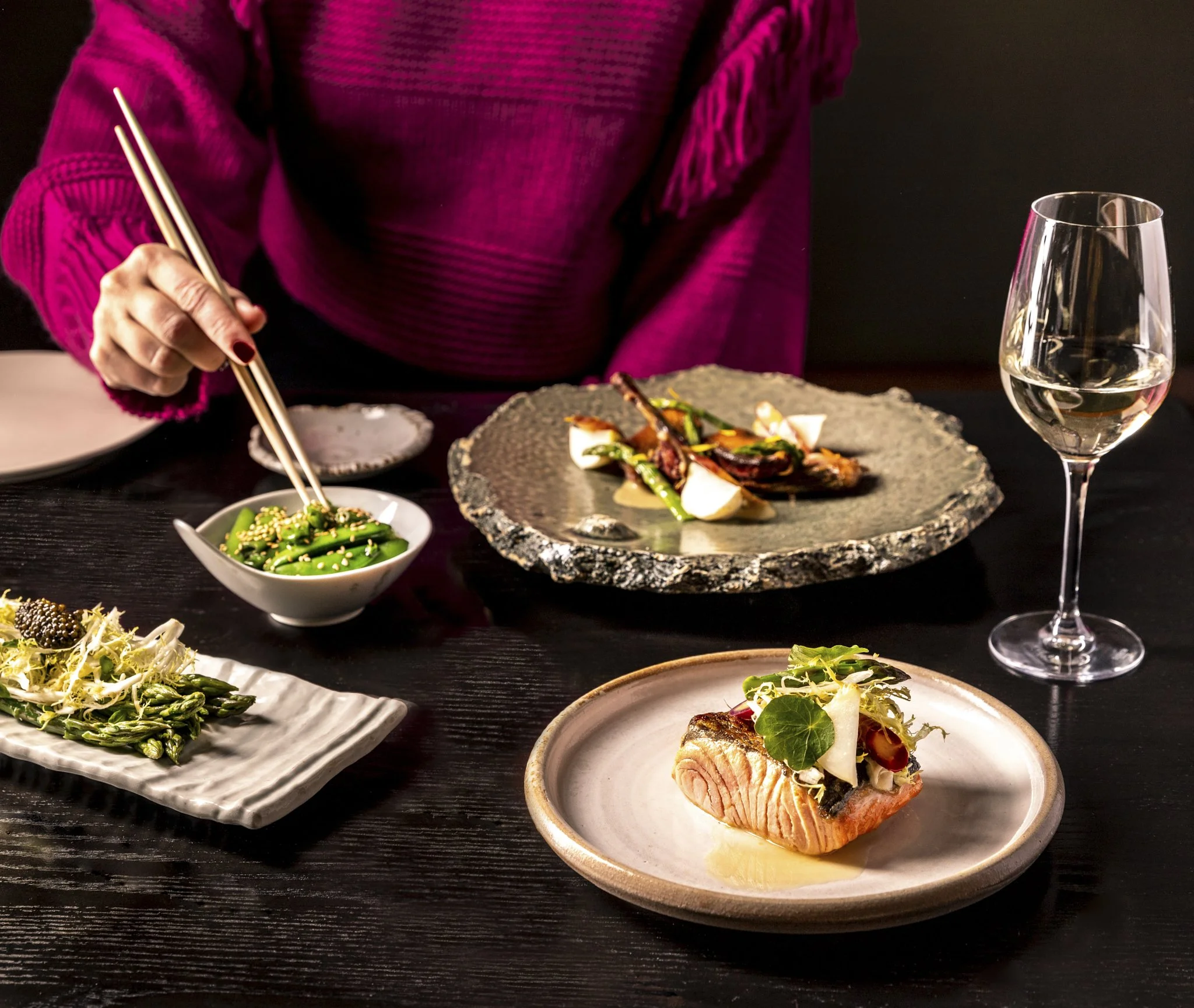 Hand with chopsticks grabbing Endamame Beans at Pabu, photographed by Neetu Laddha, restaurant photographer Secramento