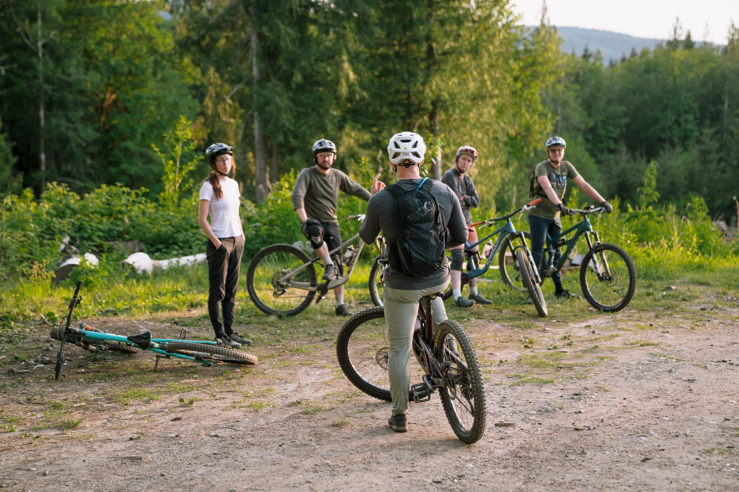 group of riders listening to coach