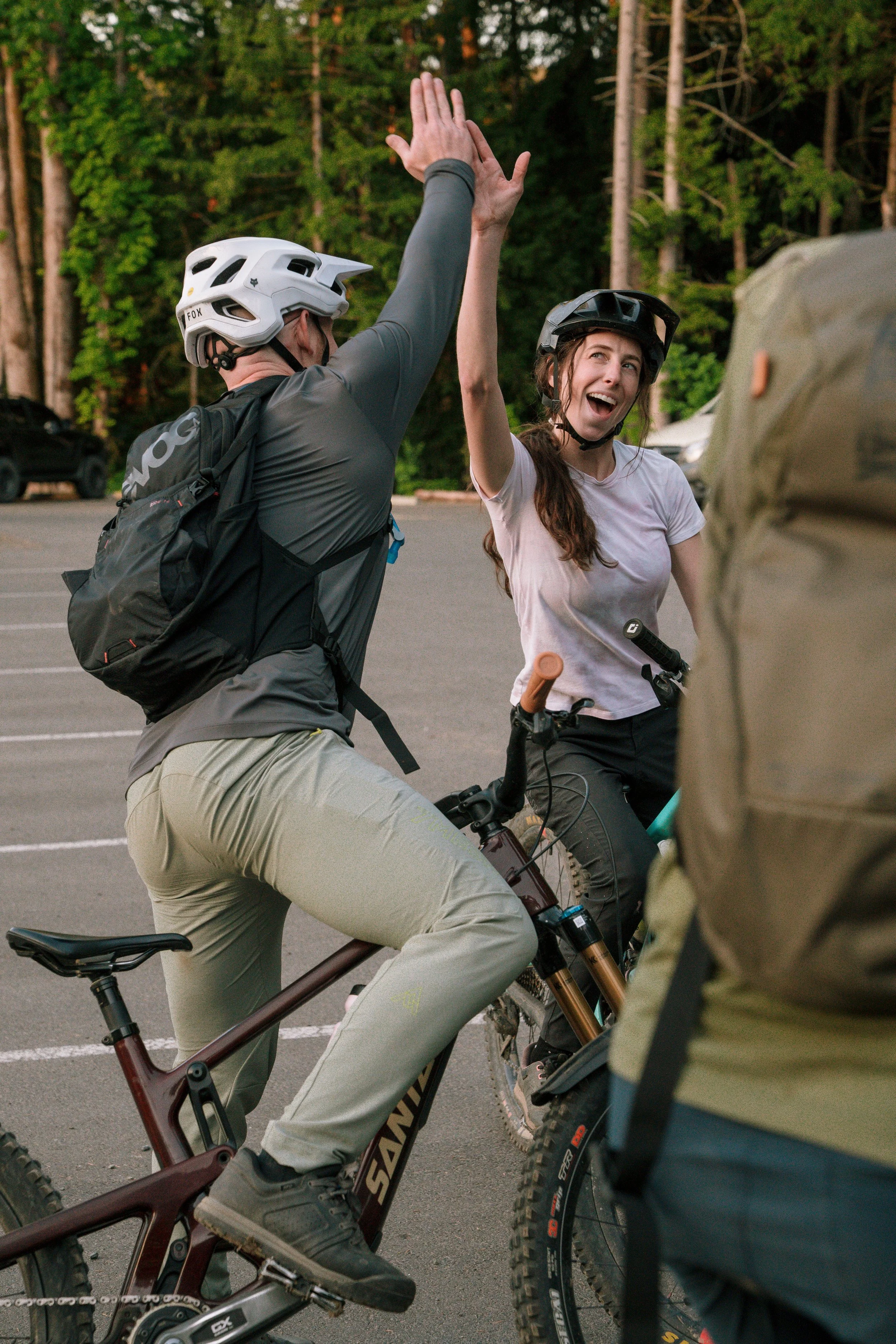 Female rider and coach high five