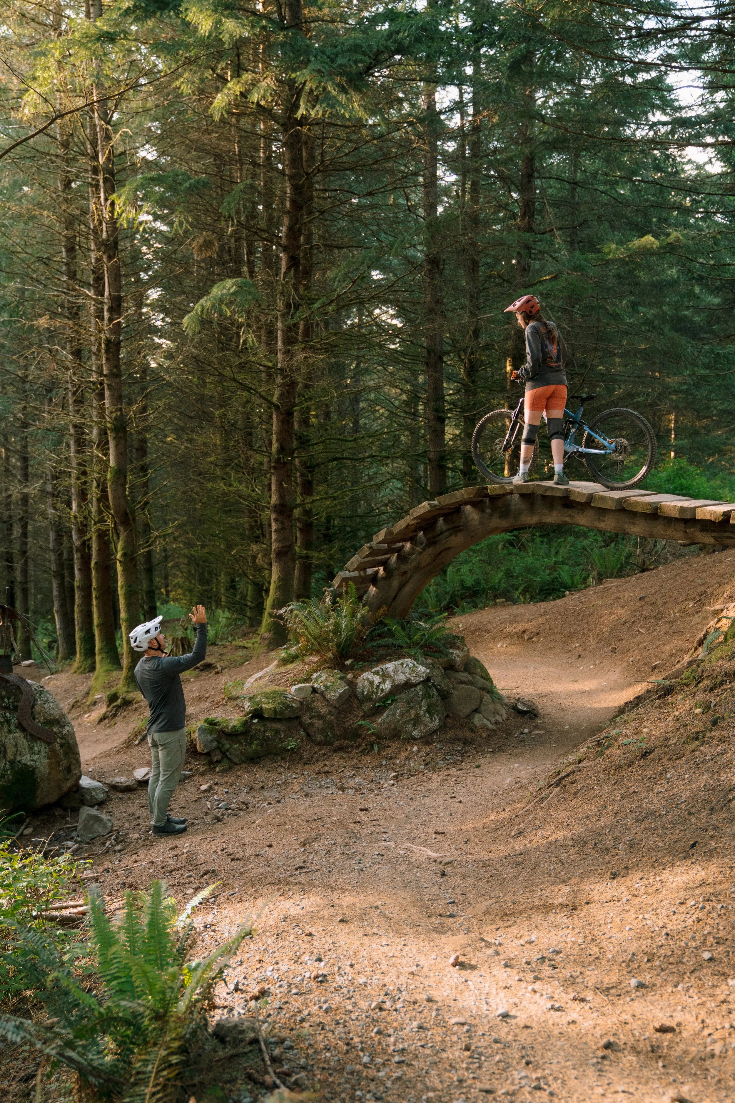 female rider on high wooden bridge