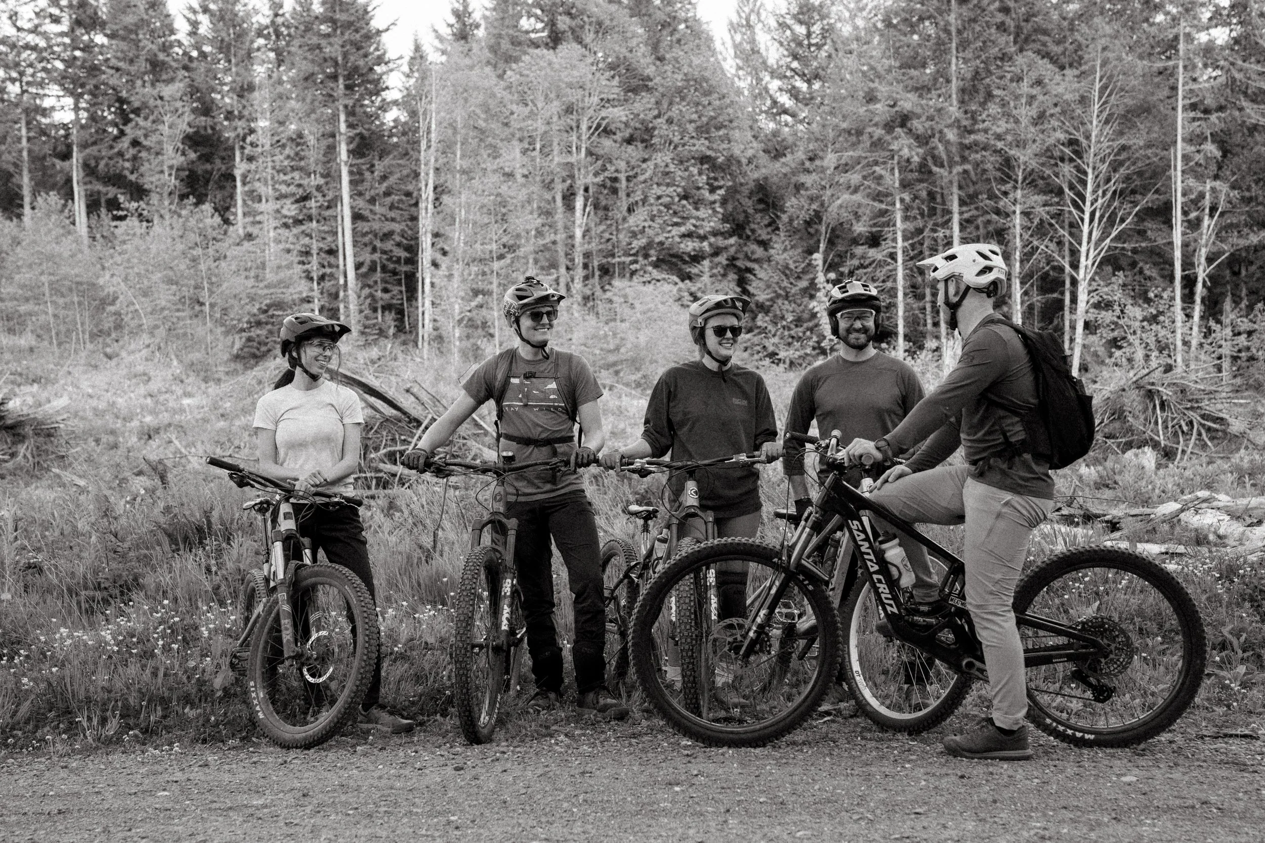 riders gathered together b/w photo