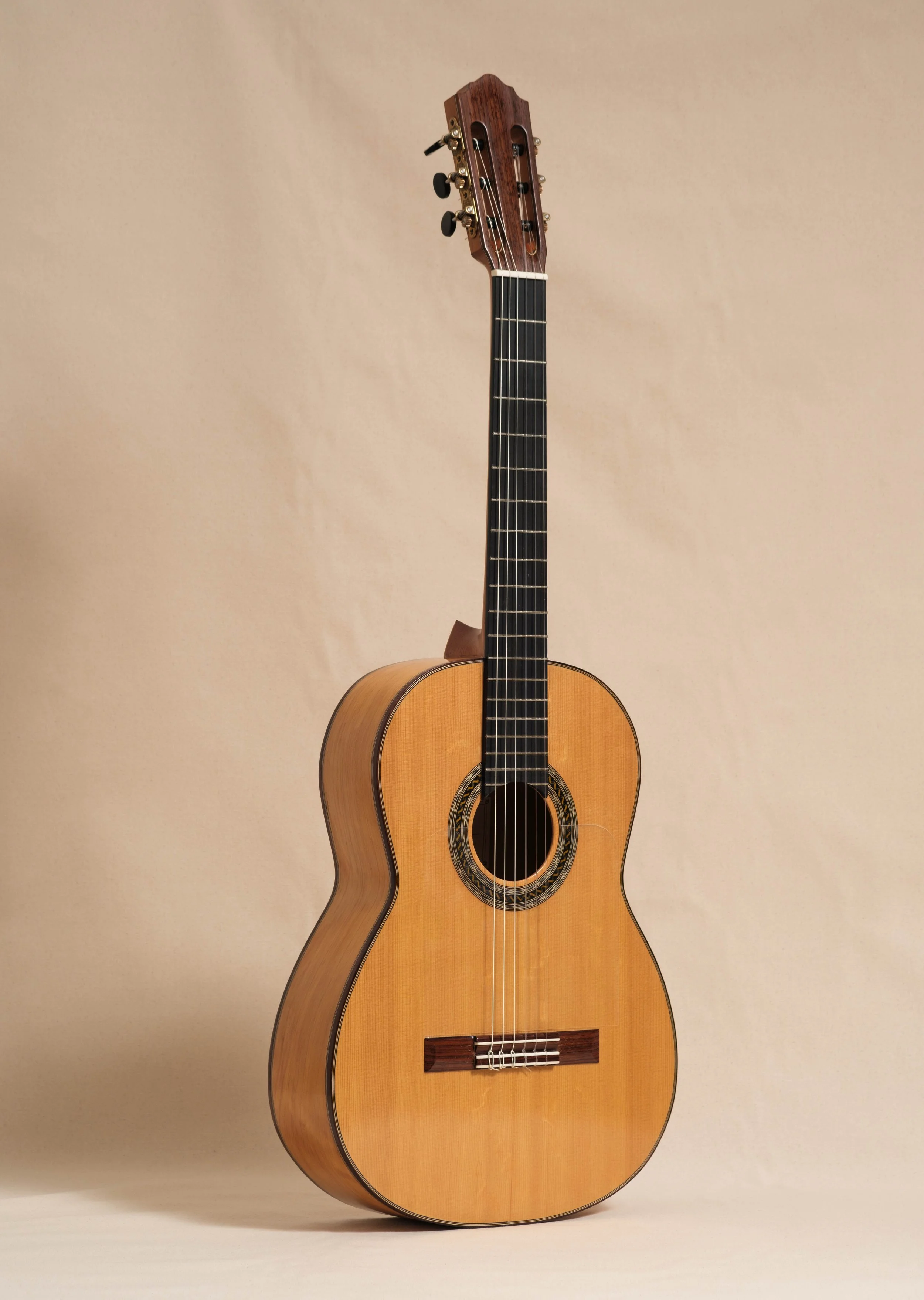 Spruce - top
 Port Oxford Cedar - back and sides
 Sloane tuners