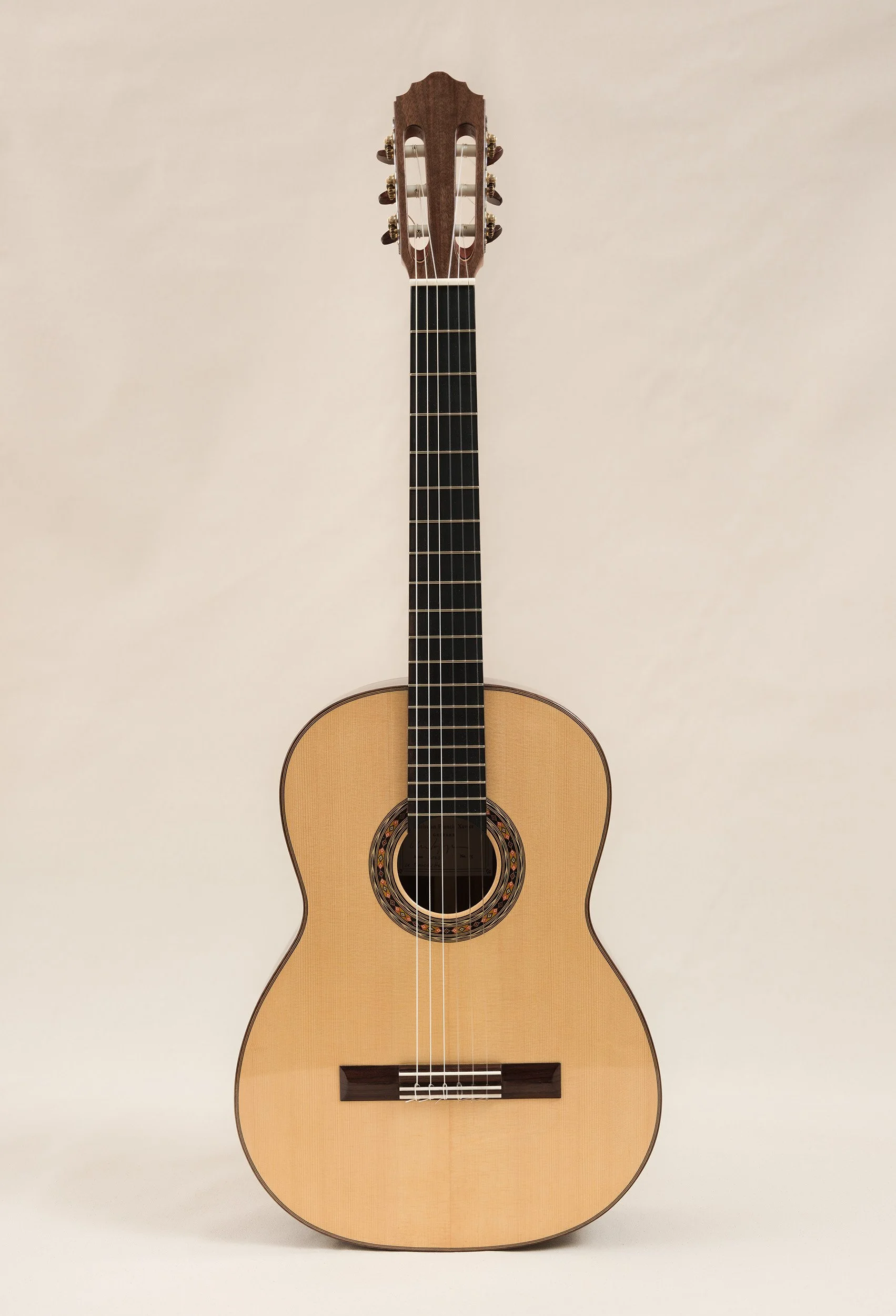 European spruce - top
 American walnut - back and sides
 Vintage Fustera tuners