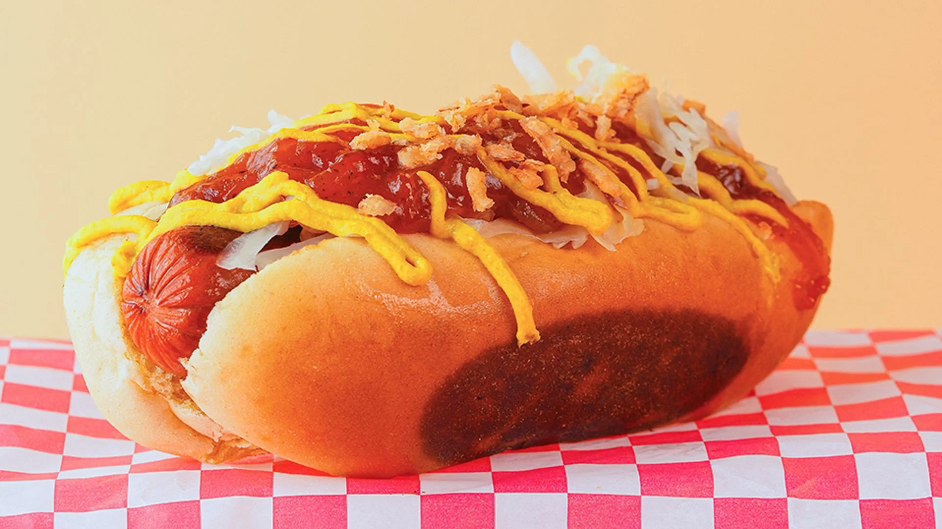 NYC loaded Sabrett all beef hot dog with NYC style onions, Morse's sauerkraut, and Raye's spicy brown mustard. Served from our food truck in Midcoast Maine and catering your next event.