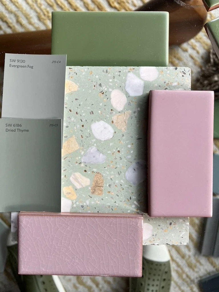 Color sample tiles and paint swatches in shades of green and pink. The swatches are labeled Evergreen Fog and Dried Thyme.