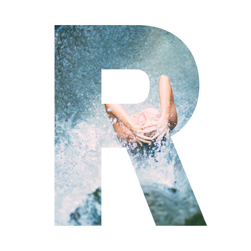 Person diving into a pool with water splashing around.