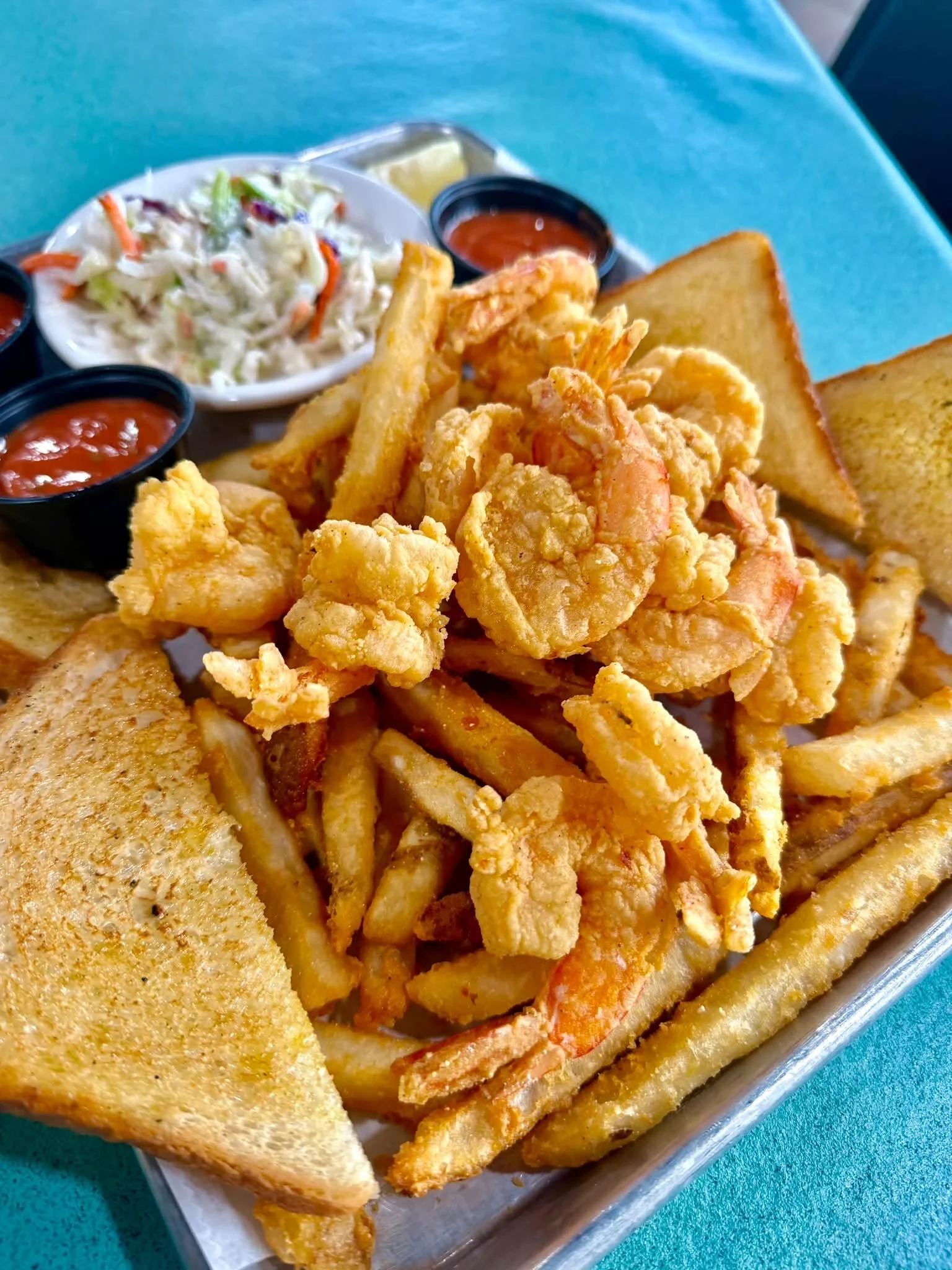 Fried shrimp platter with fries, coleslaw and toast at Kelley's Village Inn
