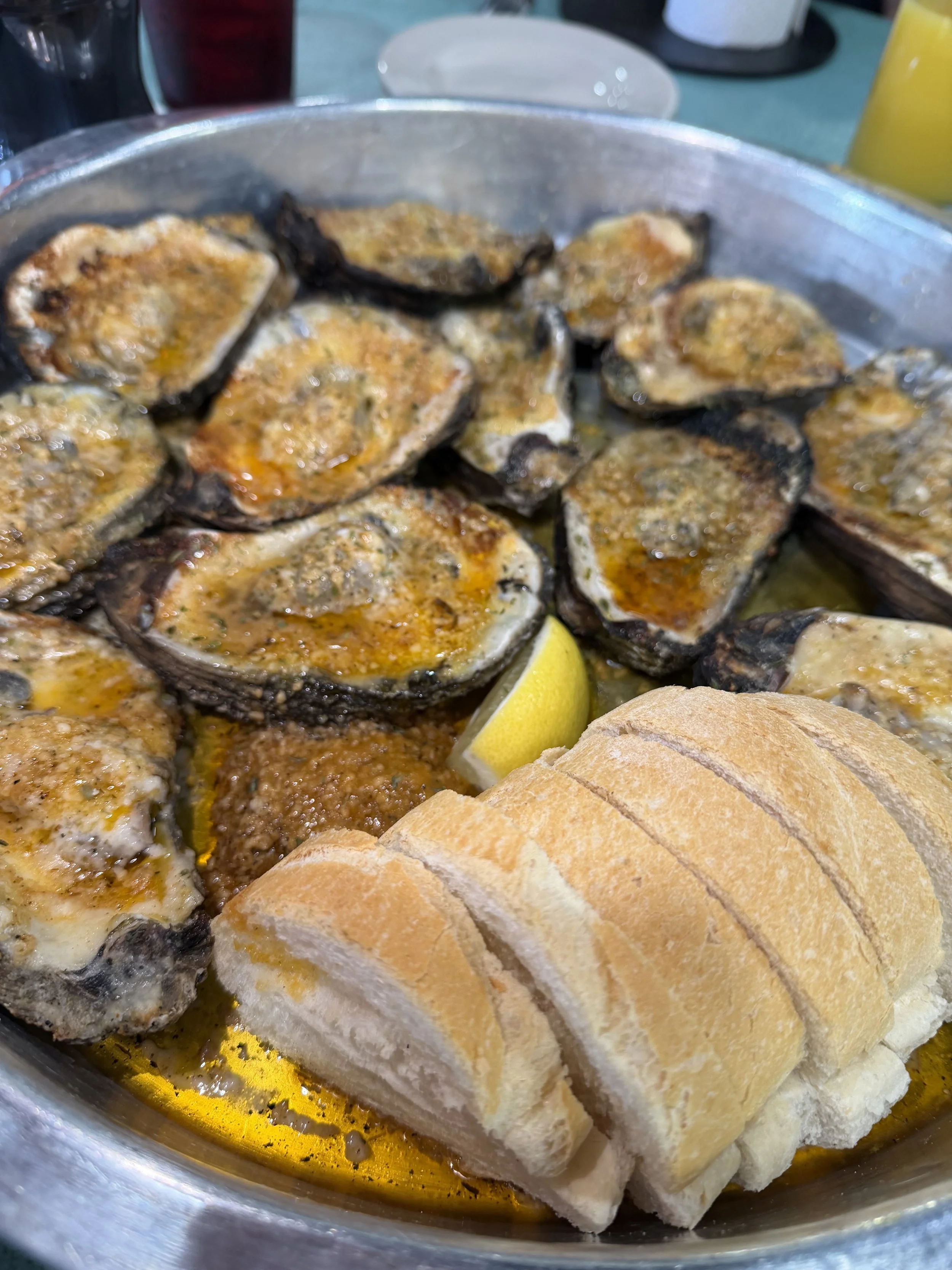 Char-grilled oysters with French bread at Kelley's Village Inn
