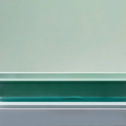 Close-up of a wall with a green ledge or shelf near the bottom.