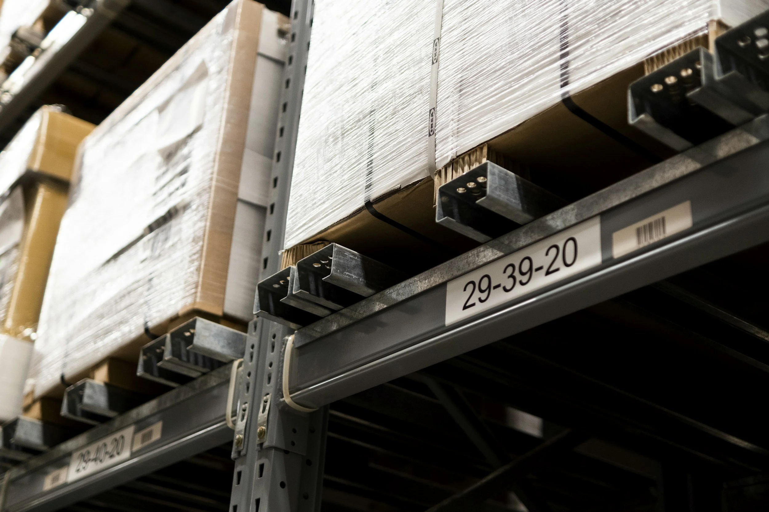 Shelves filled with boxes in a warehouse.