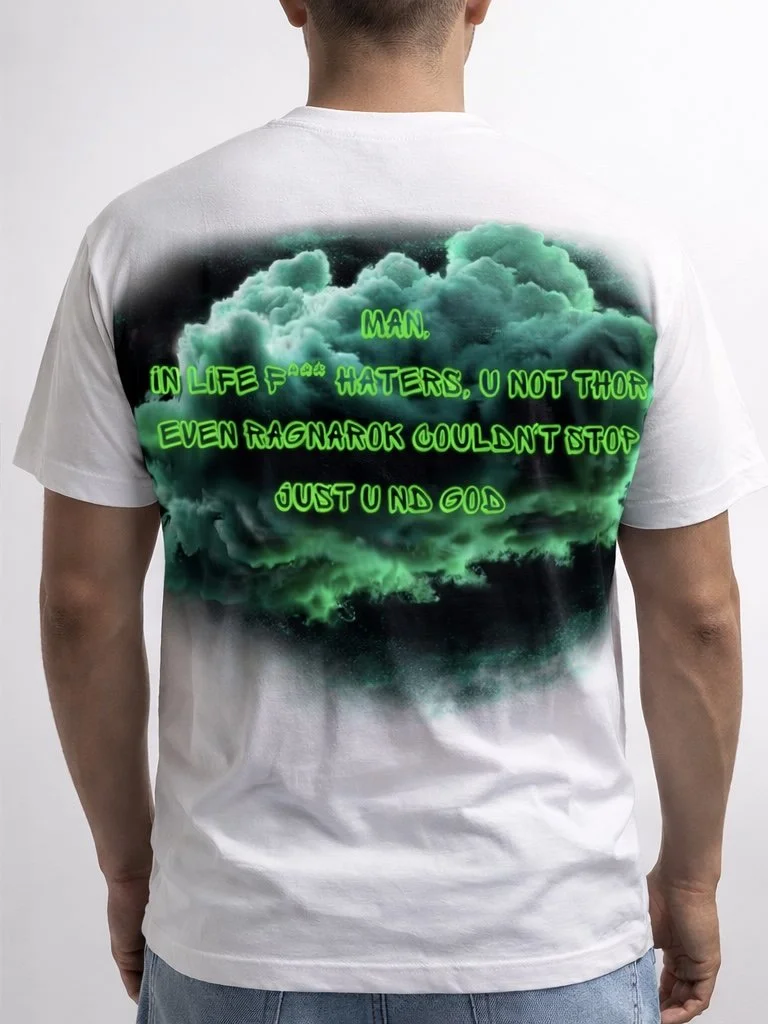 Back of a man wearing a white T-shirt with green neon text over a green cloud design.