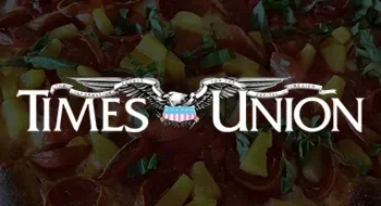 Time's Union logo with a background of a faded crowd of people.