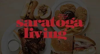 A plate with various baked goods, including cookies and muffins, on a table.