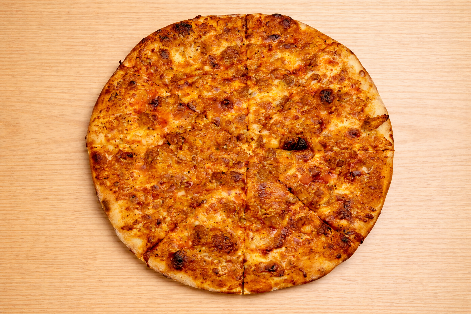 Whole pepperoni pizza on a wooden surface