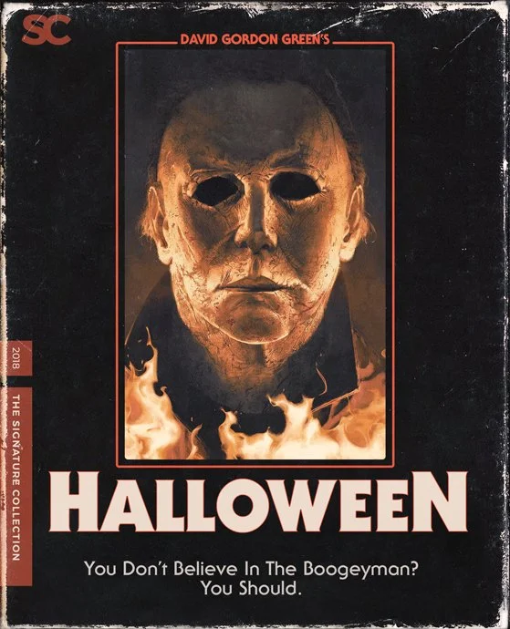 A vintage-style Halloween (2018) film cover featuring Michael Myers' masked face surrounded by flames.
