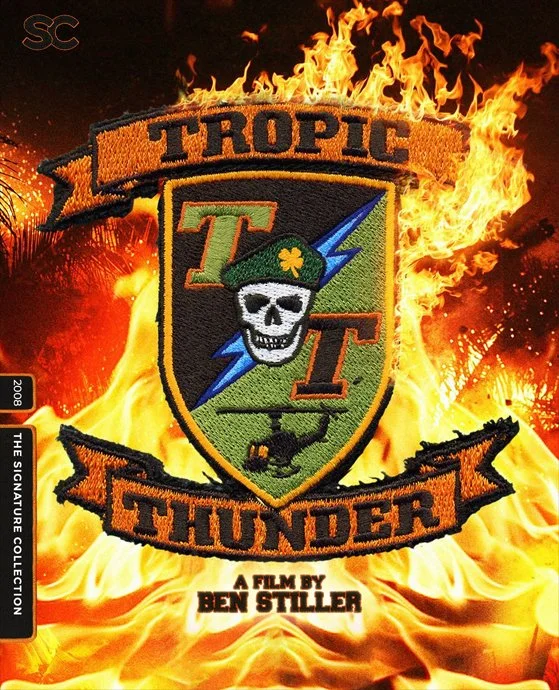 Movie poster for 'Tropic Thunder' featuring a shield emblem with a skull wearing a beret, a lightning bolt, and a helicopter, surrounded by flames.
