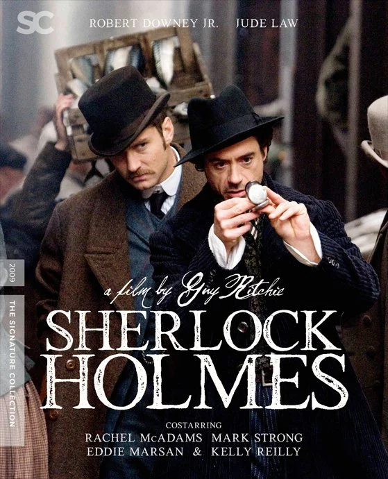 Cover of the film 'Sherlock Holmes' featuring Robert Downey Jr. and Jude Law in period costumes, with Downey inspecting a pocket watch.