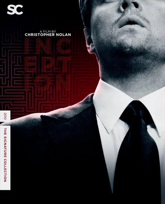Close-up of a man in a suit with a white shirt and black tie, with a partial view of his face and shoulder, against a dark background with red maze pattern and the text "Inception".