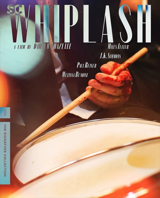 Close-up of a hand holding a drumstick over a drum, with magazine cover text reading "Whiplash" and credits to Damien Chazelle, J.K. Simmons, Miles Teller, Paul Reiser and Melissa Benoist.