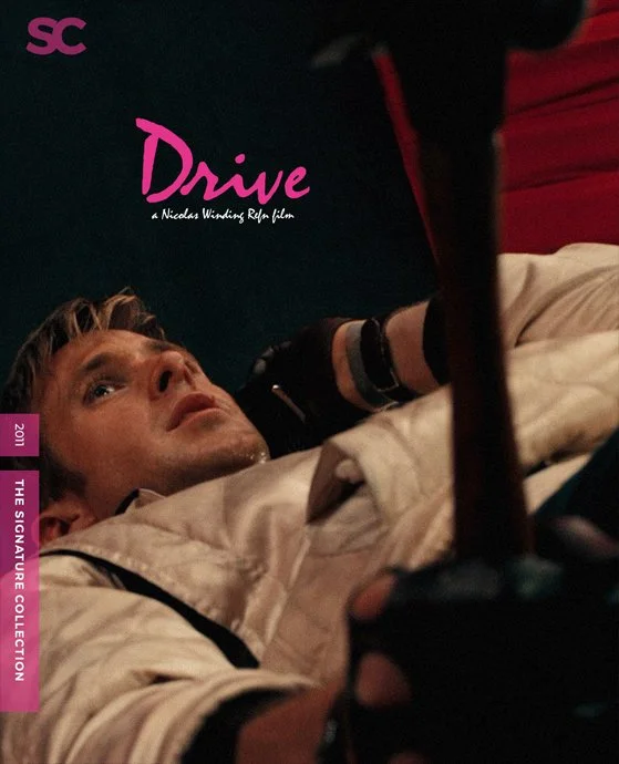 Close-up of Ryan Gosling holding a hammer, with a black and red background featuring the words 'Drive' and 'a Nicolas Winding Refn film'