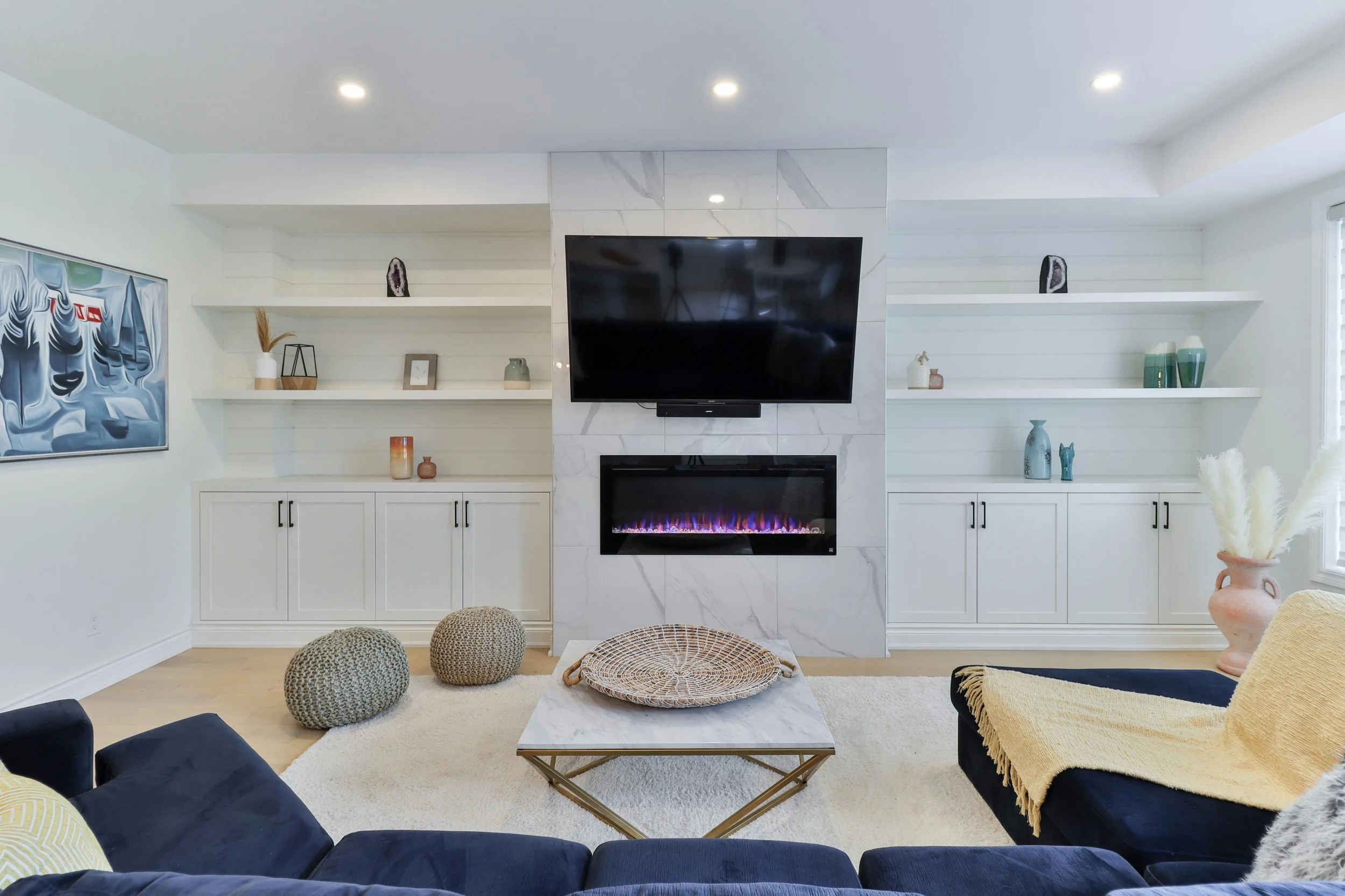 Premium domestic cleaning in Altrincham: a dust-free, organized living room with a perfectly vacuumed rug and pristine shelving.