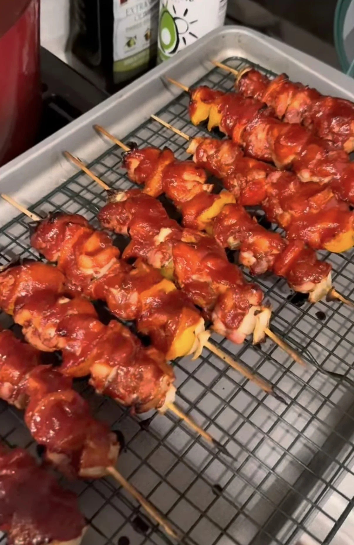 Skewers of chicken and vegetables covered in sauce
