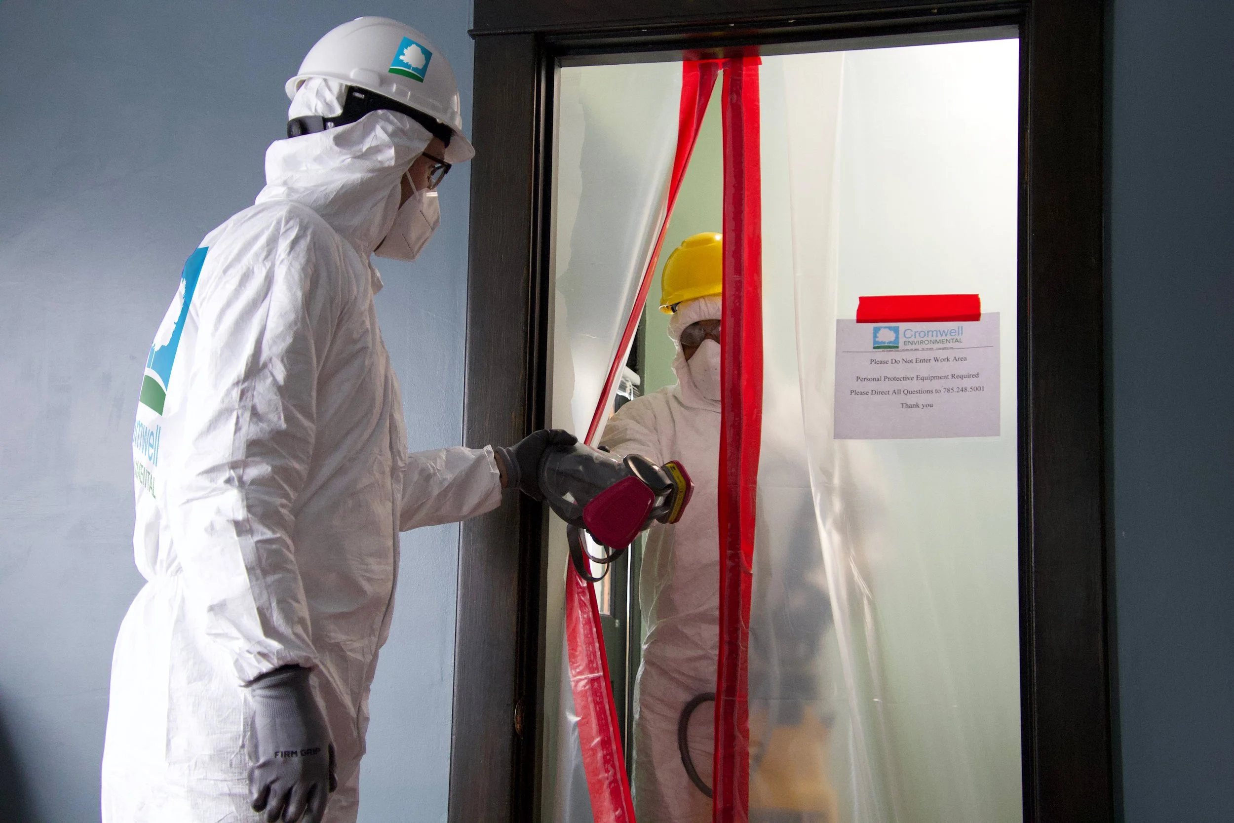 Cromwell Environmental staff removing asbestos.