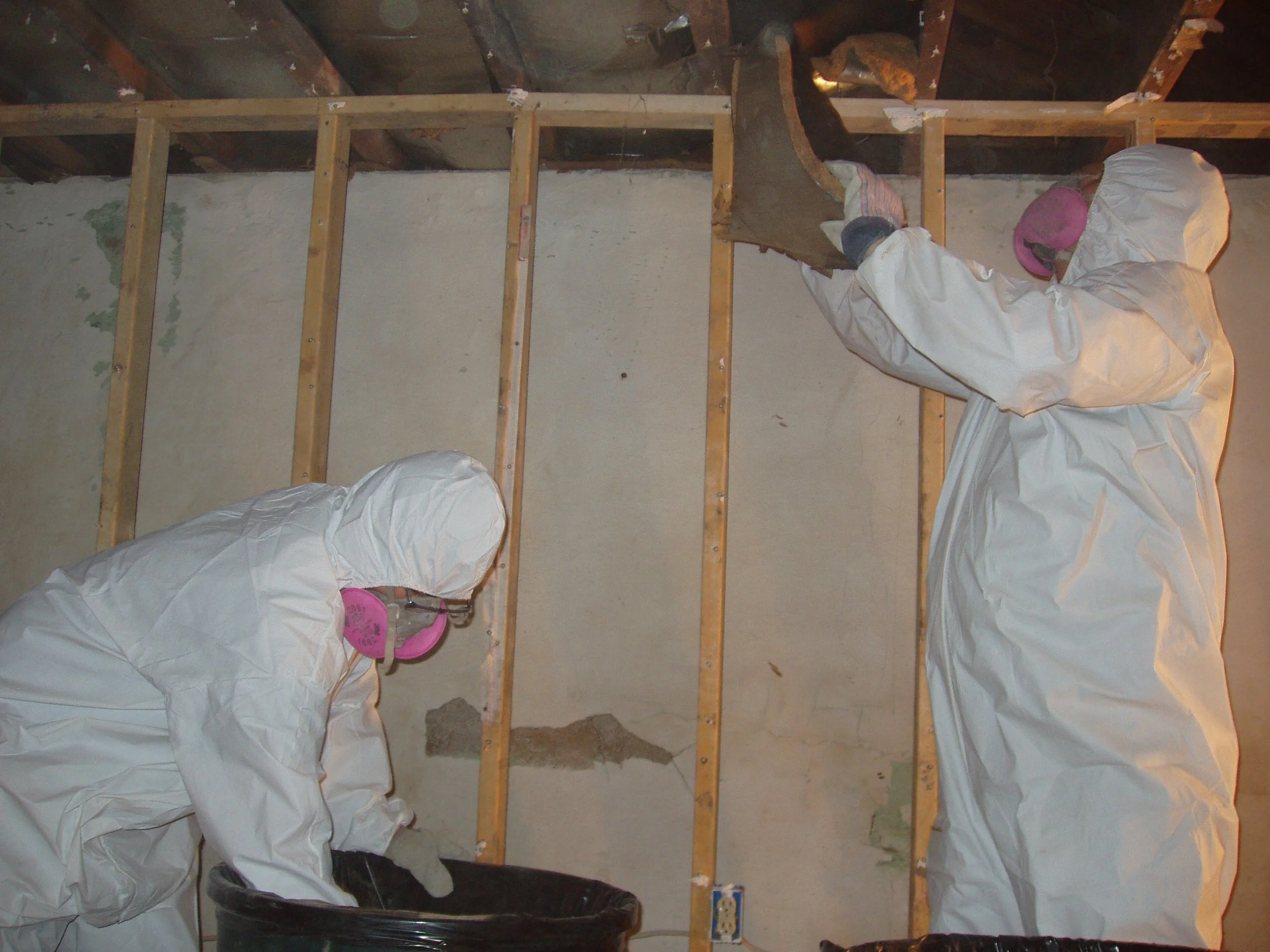 Cromwell staff performing remediation work in a basement.
