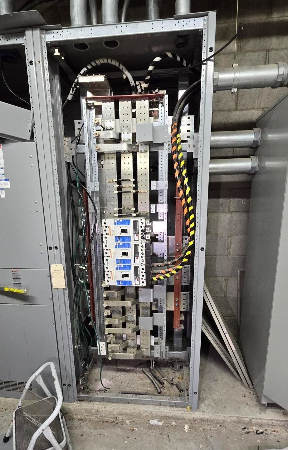 A complex electrical panel open to be worked on.