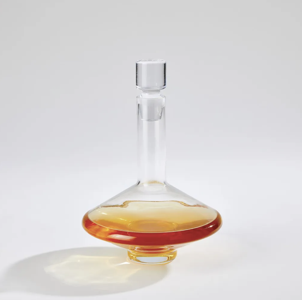 Glass decanter with amber-colored beverage for a curated home bar and entertaining space.
