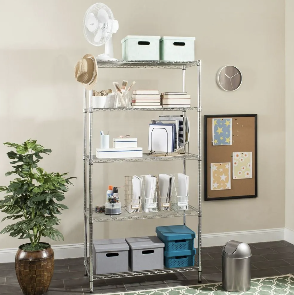 Organized metal shelving with storage boxes, office supplies, notebooks and art materials.