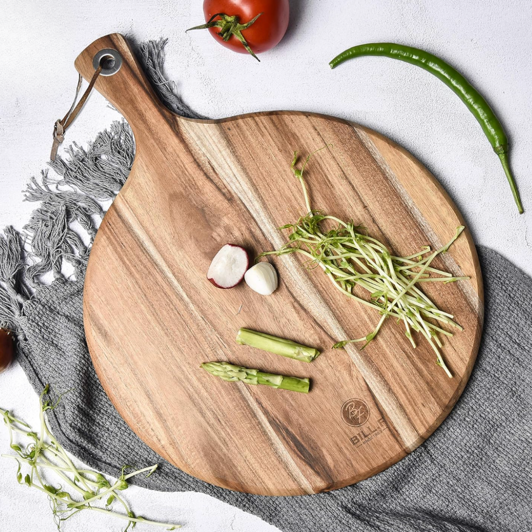 Wood cutting board styled with fresh vegetables and herbs for kitchen and home entertaining.