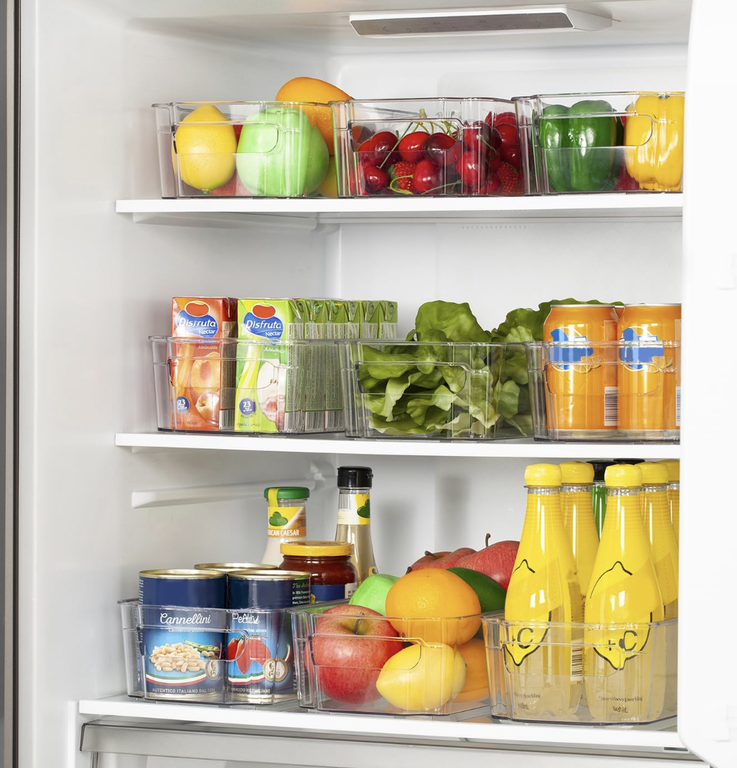 Organized refrigerator with fresh produce, beverages, condiments and kitchen storage containers.