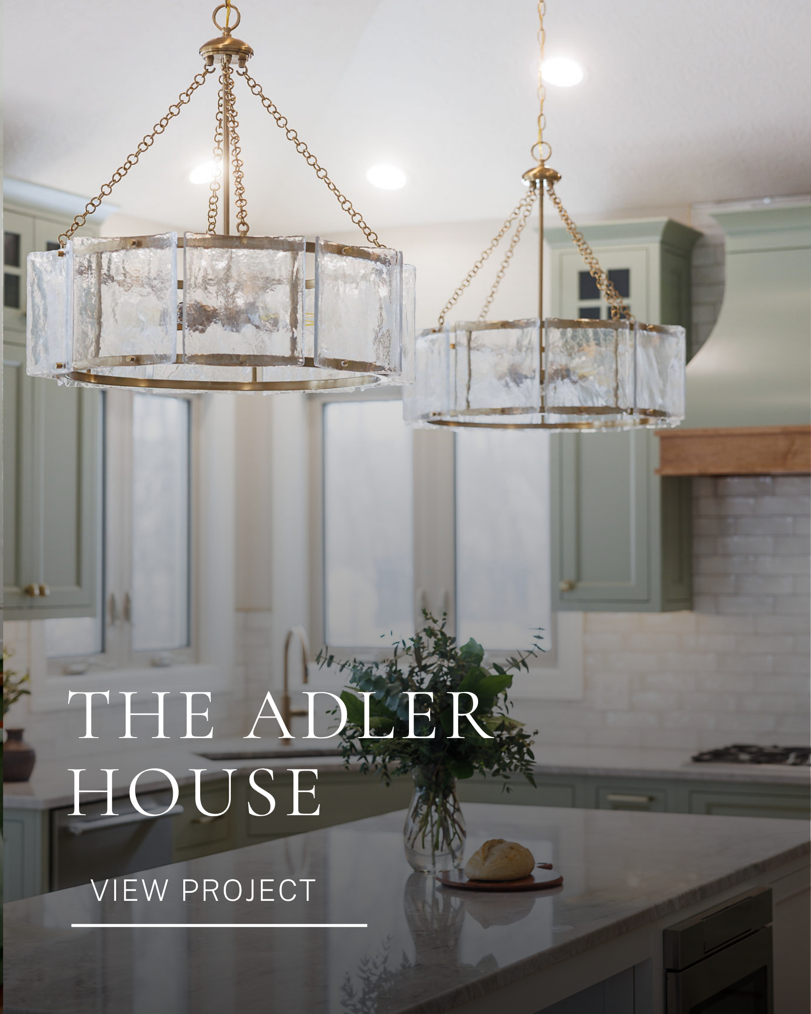The Alder House residential kitchen renovation featuring statement chandeliers, curated decor and a modern kitchen island.