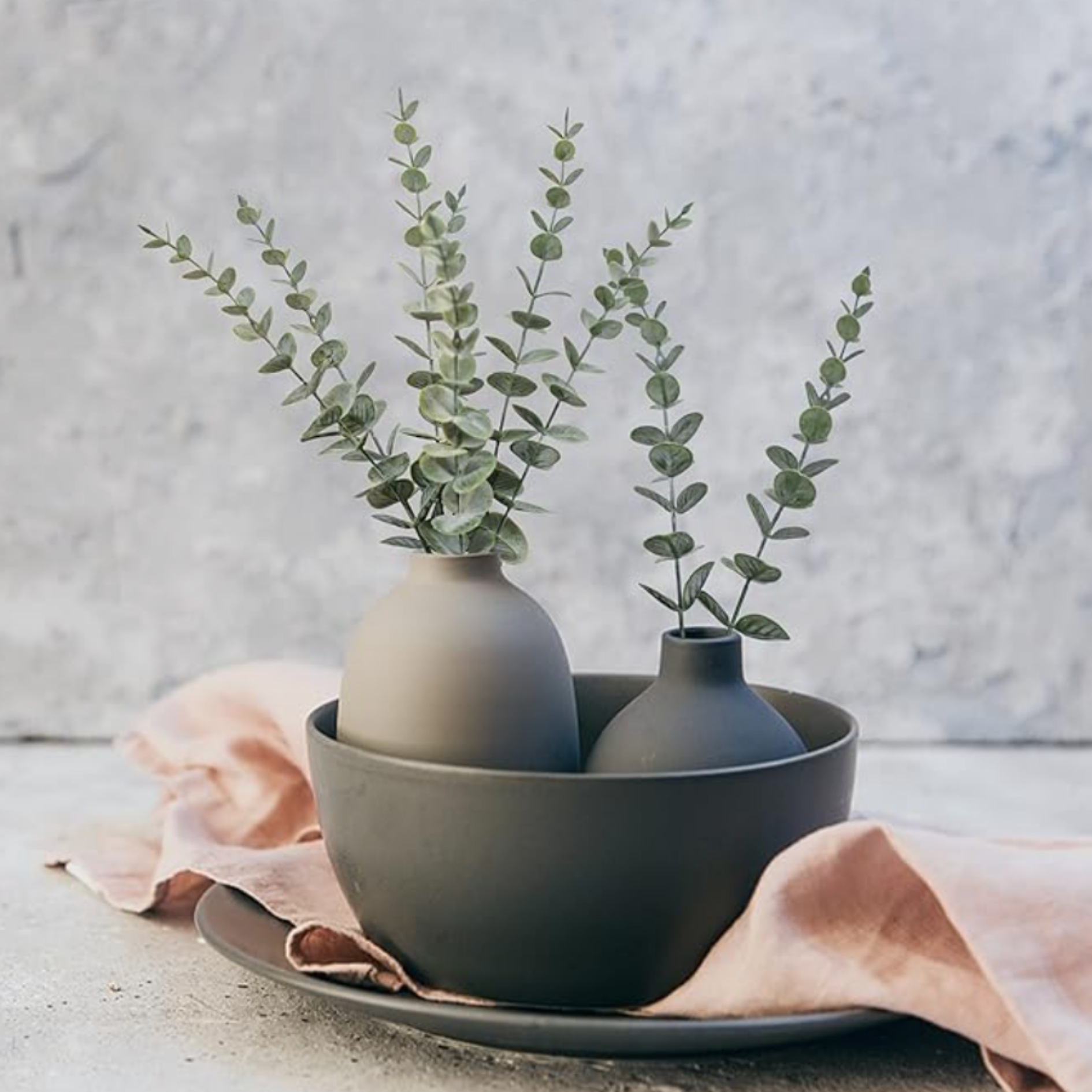 Silver dollar eucalyptus in a gray vase styled as natural home decor.