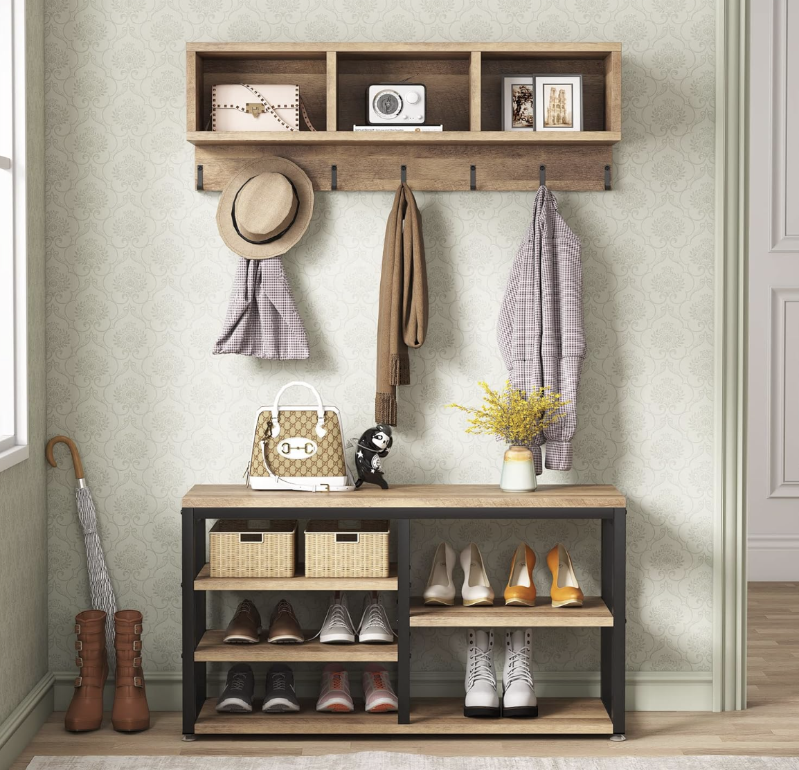 Organized entryway storage with wall hooks, shoe rack, accessories and decorative accents.