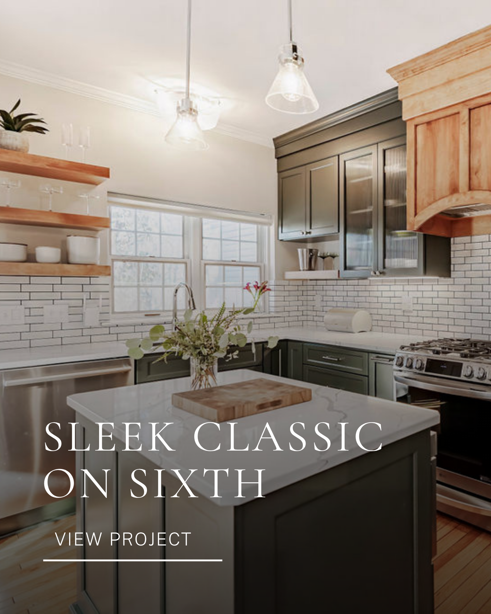Residential kitchen interior design featuring gray cabinetry, open shelving, subway tile and pendant lighting.
