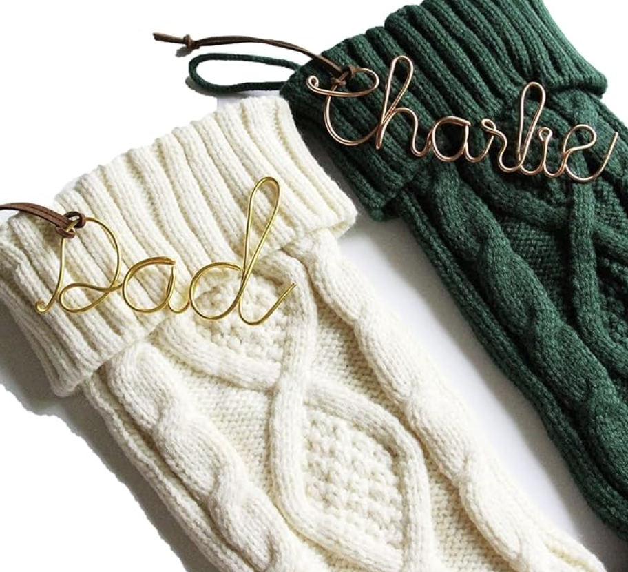 Personalized cream and green knit scarves with Dad and Charlie name tags.