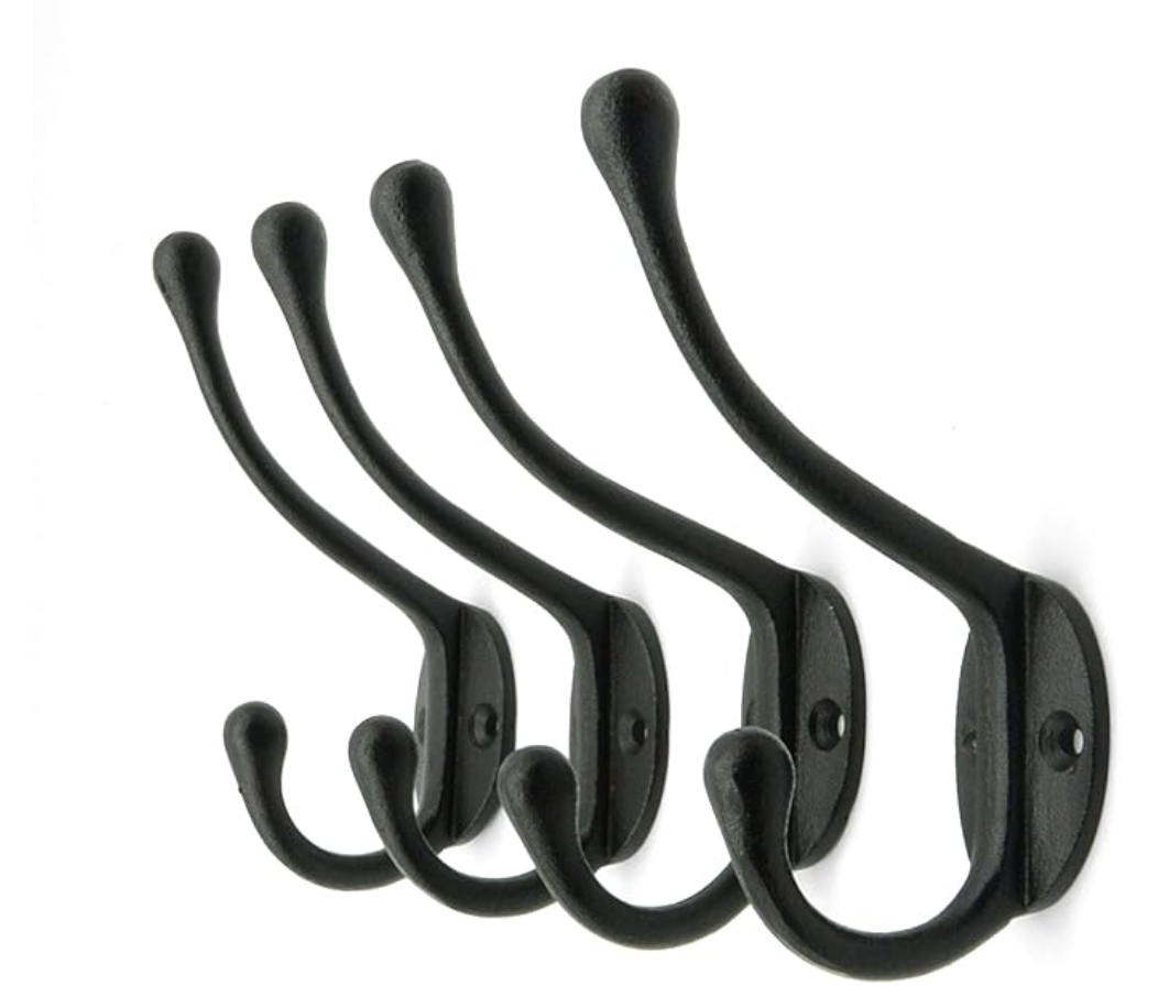 Black metal wall hooks in varying sizes for modern entryway and home organization.