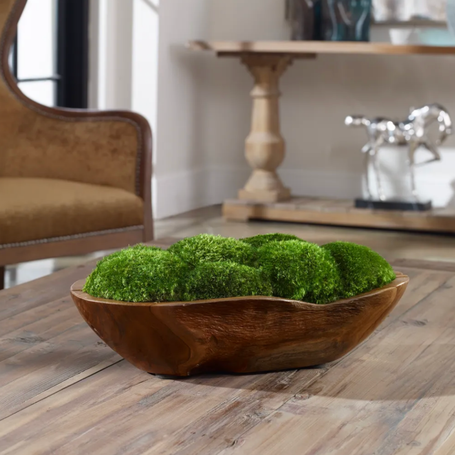 Natural wood decorative bowl filled with green moss for organic interior styling.