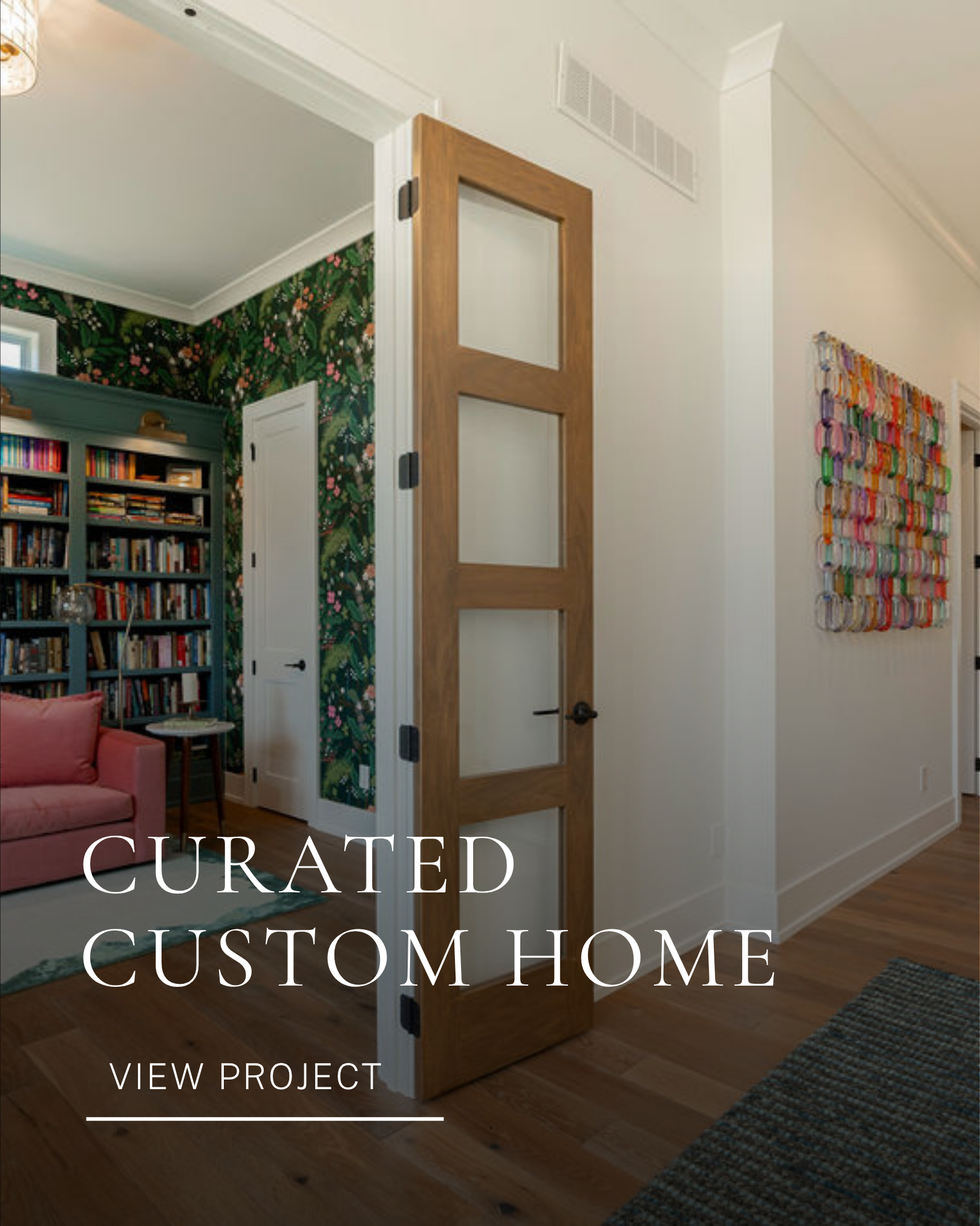1. Residential entryway interior design featuring floral wallpaper, built-in shelving and colorful curated details.