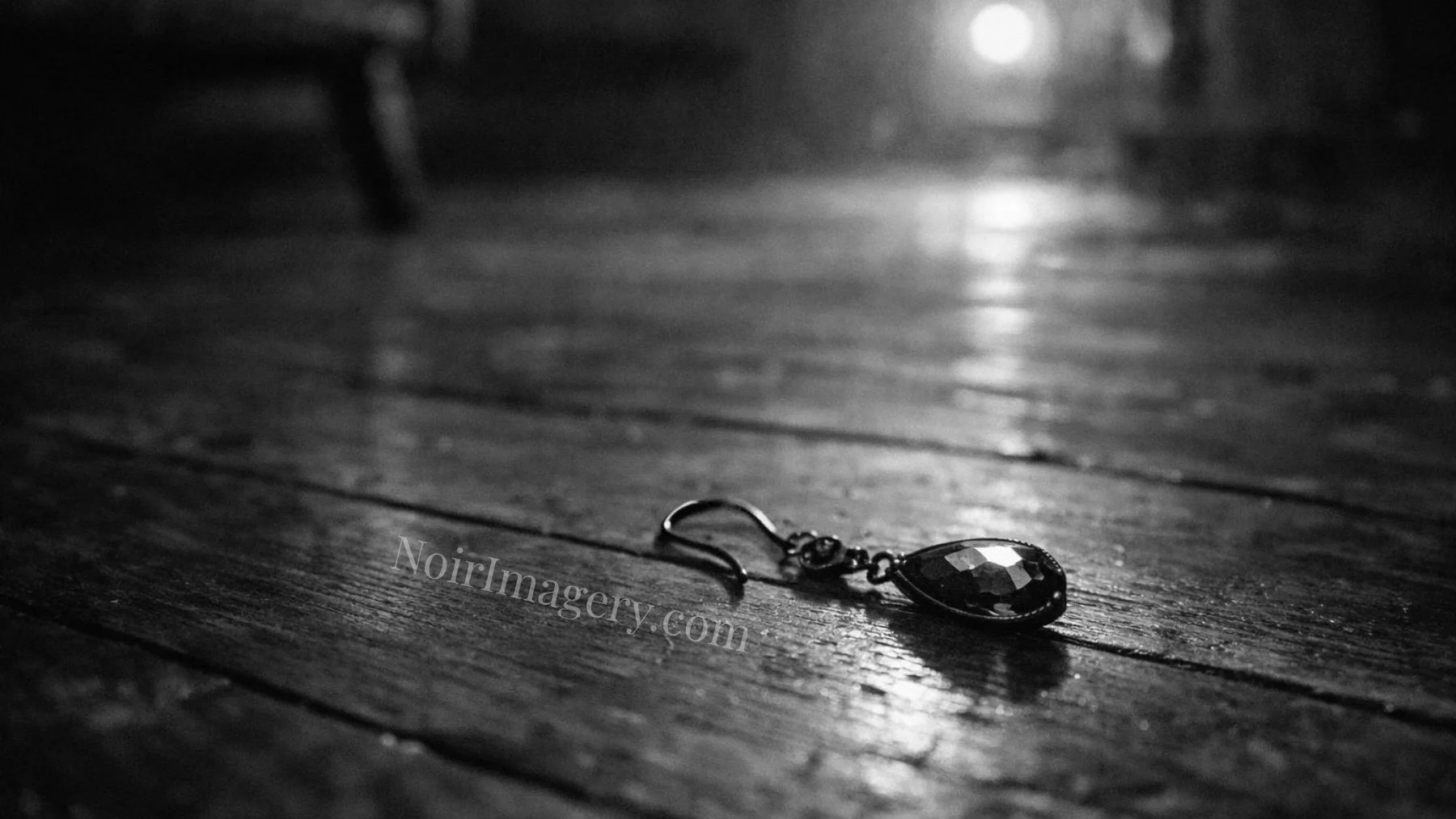 Single dangling earring lying on worn wooden floorboards in a dimly lit noir interior.