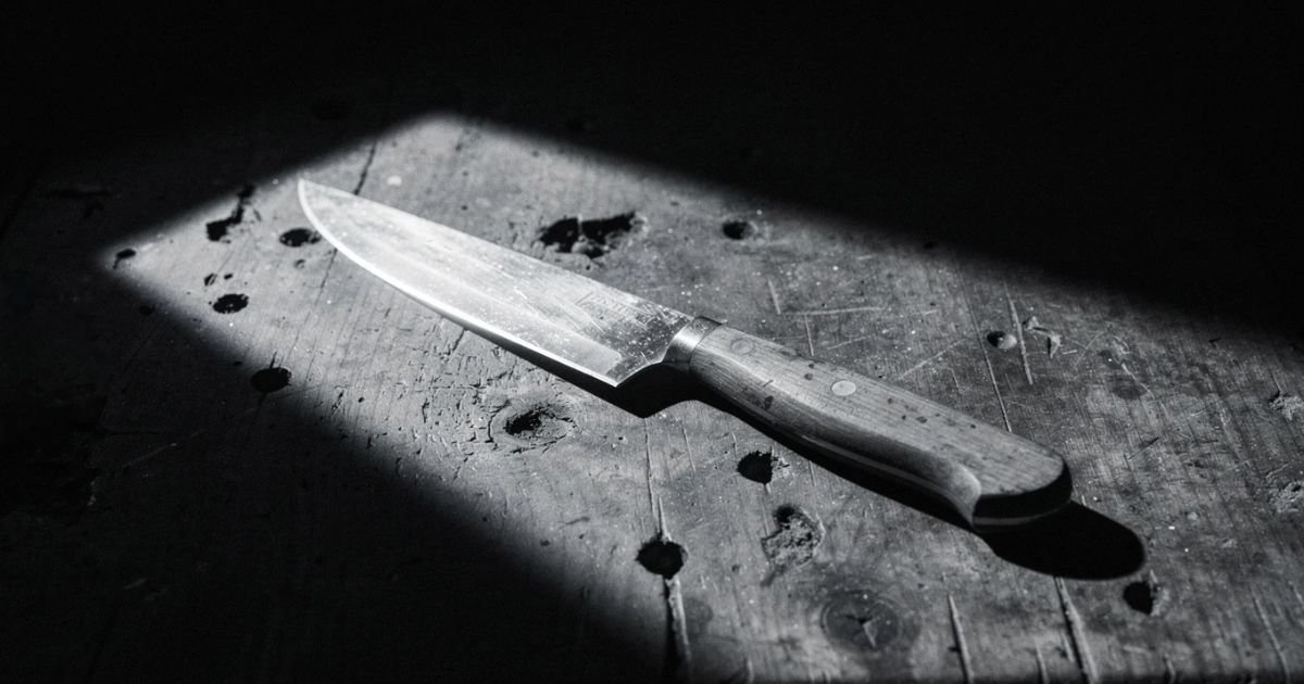 Noir knife close-up with dramatic lighting, representing tools and methods in crime storytelling imagery