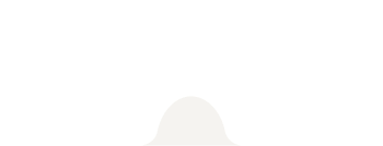 Silhouette of a person climbing a mountain at sunset.