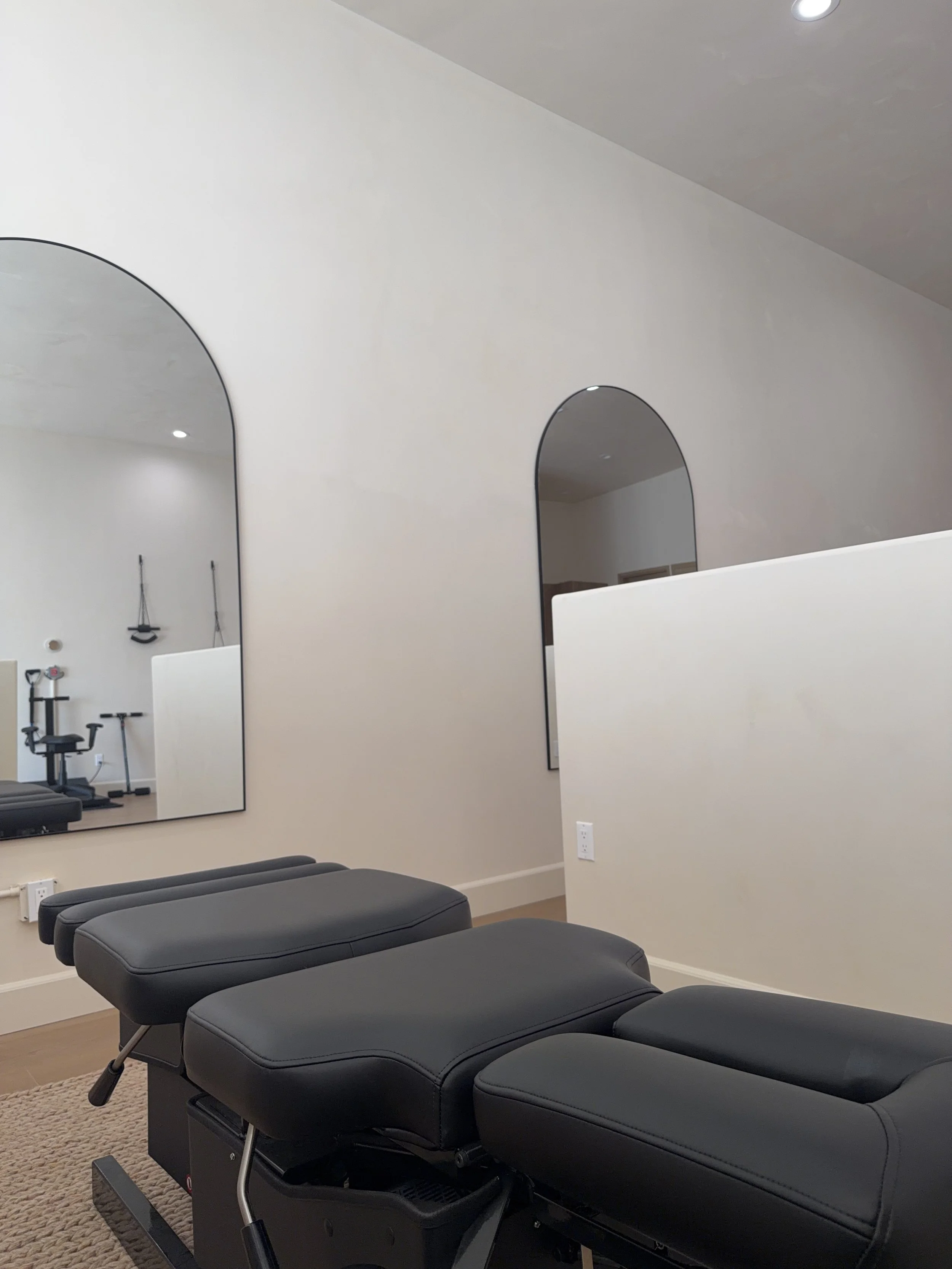 Chiropractic treatment table inside Adjust + Align’s Studio City, LA office