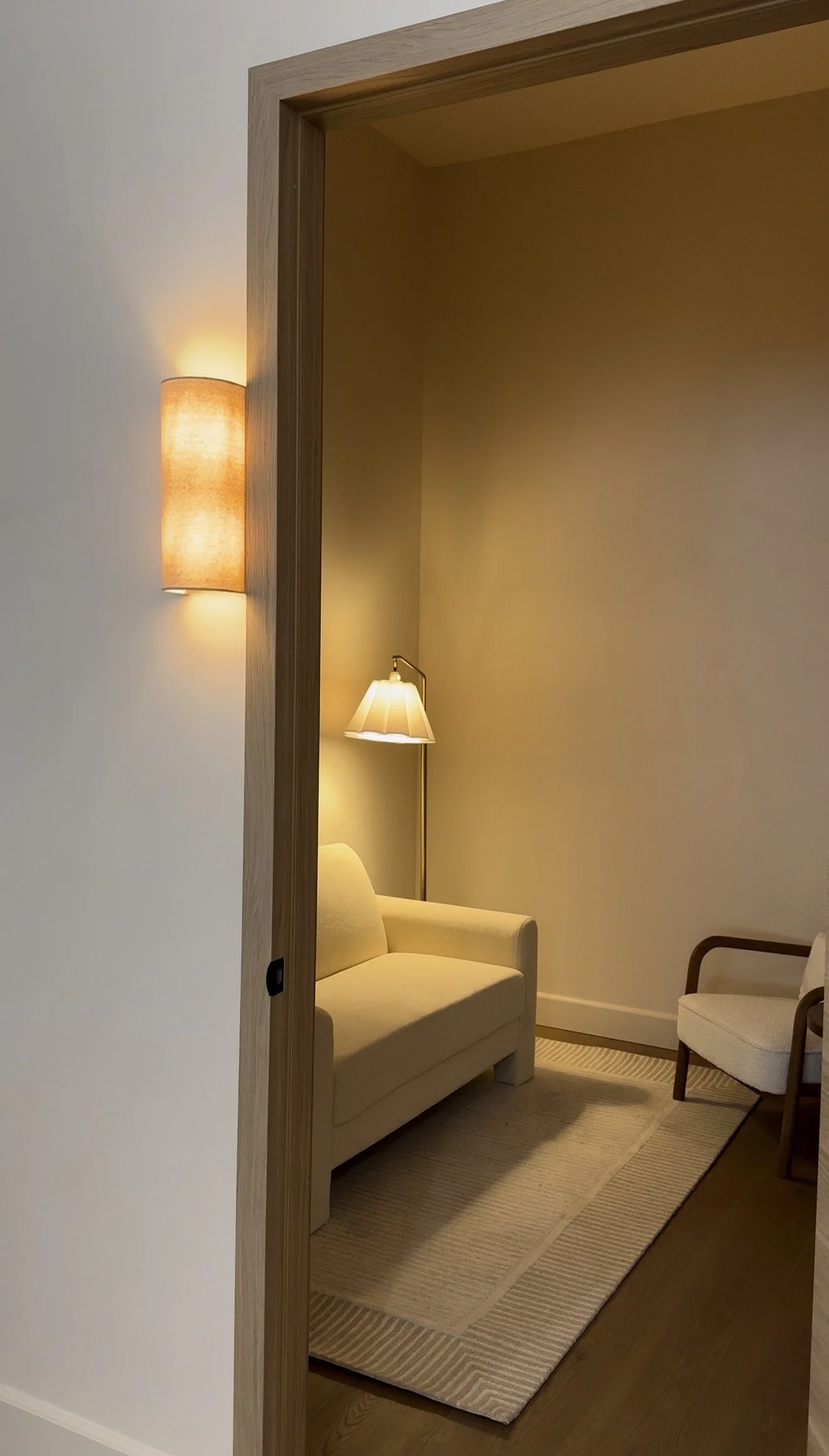 Softly lit, calming treatment room at Adjust + Align in Studio City, LA
