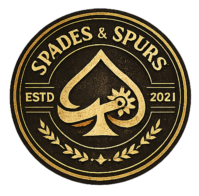A circular emblem set against a black background with gold detailing, showcasing a stylized spade with an internal floral motif at its center. The name “Spades & Spurs” is positioned at the top, “ESTD 2021” appears on both sides, and laurel branches