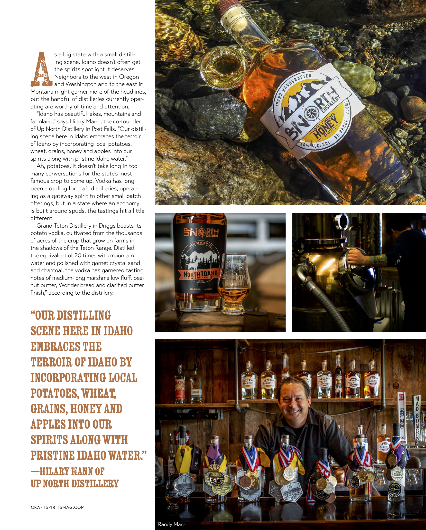 A man sitting in front of shelf with medals and bottles of spirits, with labels indicating they are from Up North Distillery, Idaho. The photo is taken inside a distillery with wooden decor and motivational quotes on the wall.